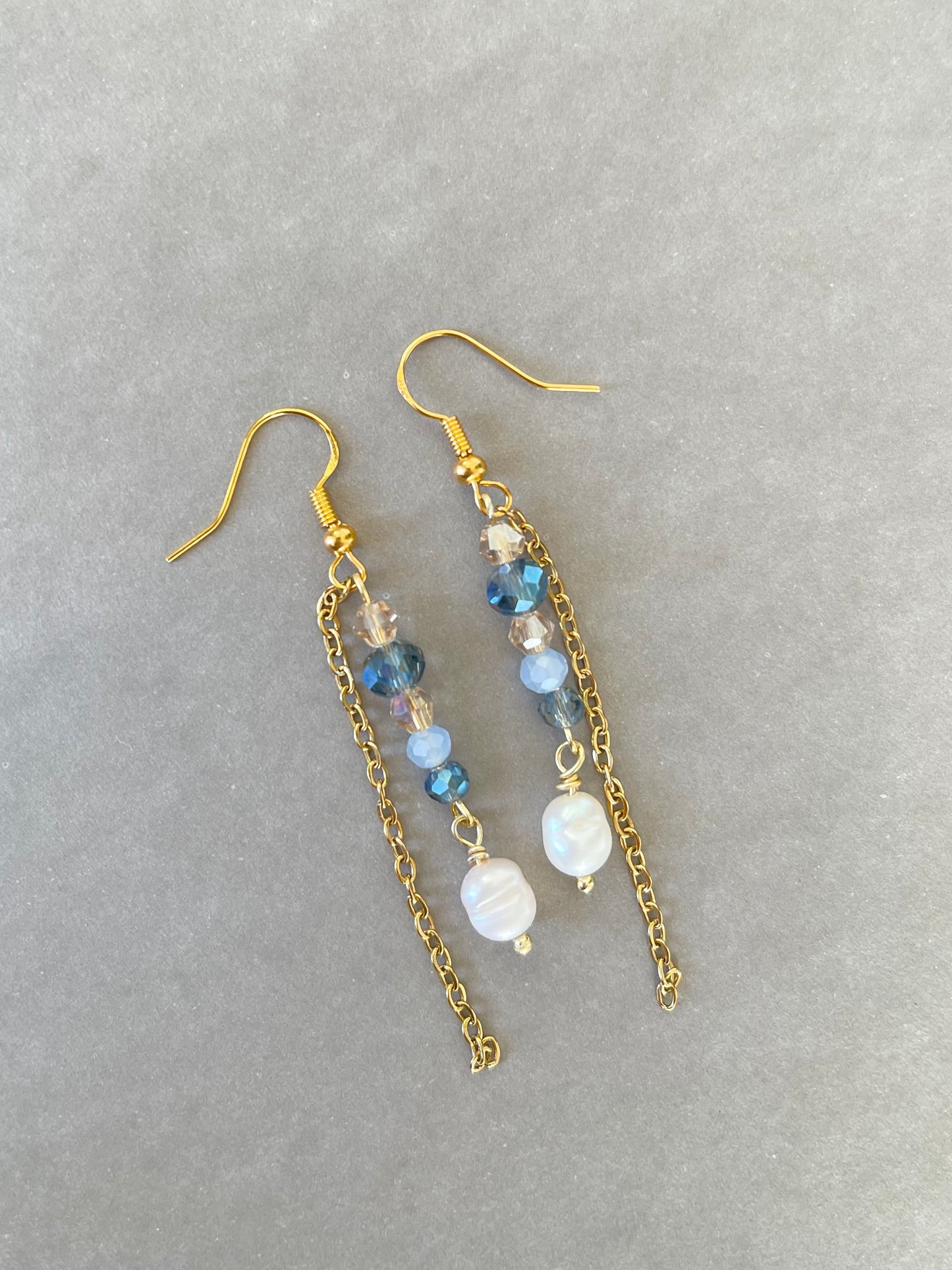 Gold earring with navy blue