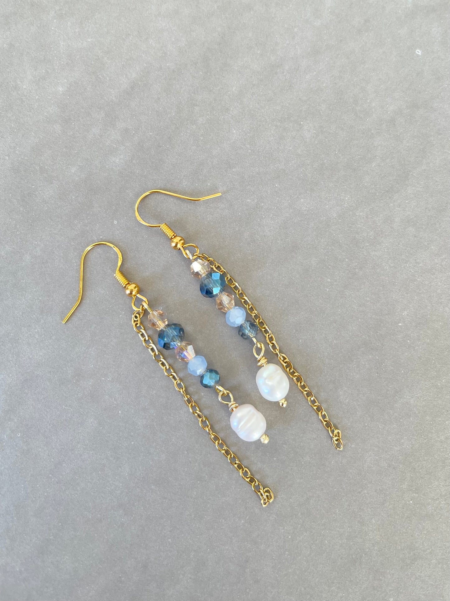 Gold earring with navy blue